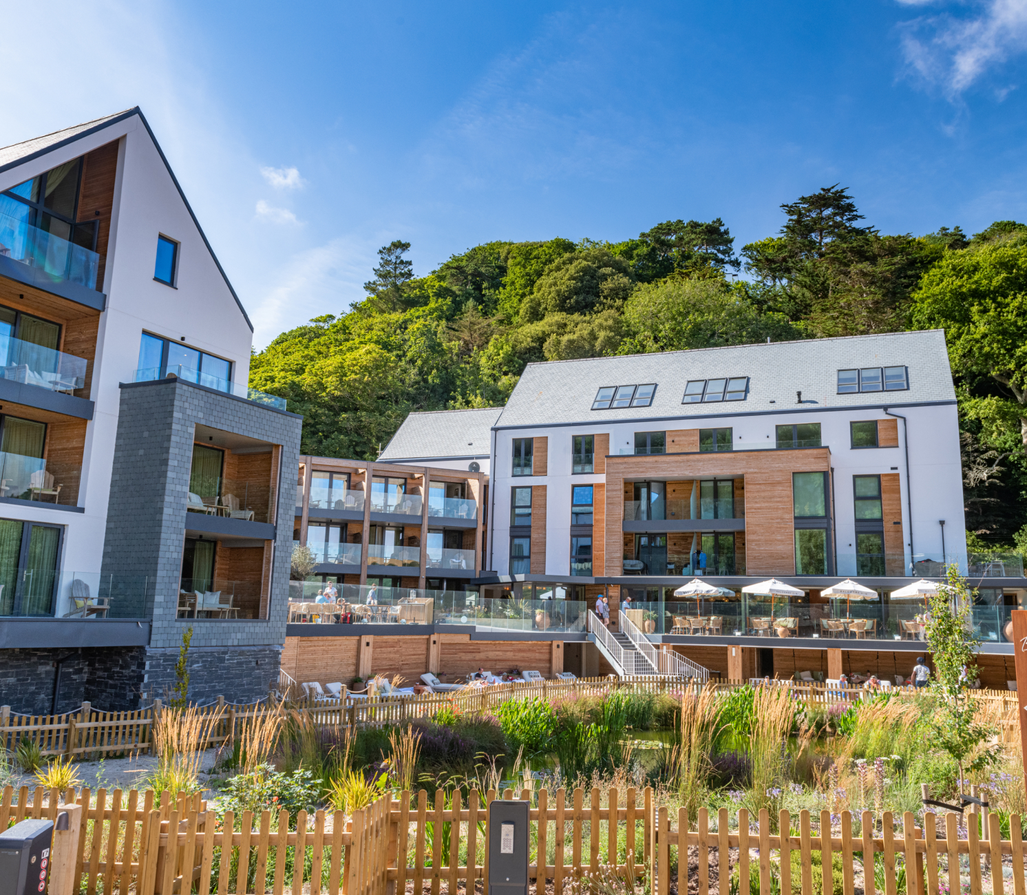 Back of the Harbour Hotel with balcony and sunbeds